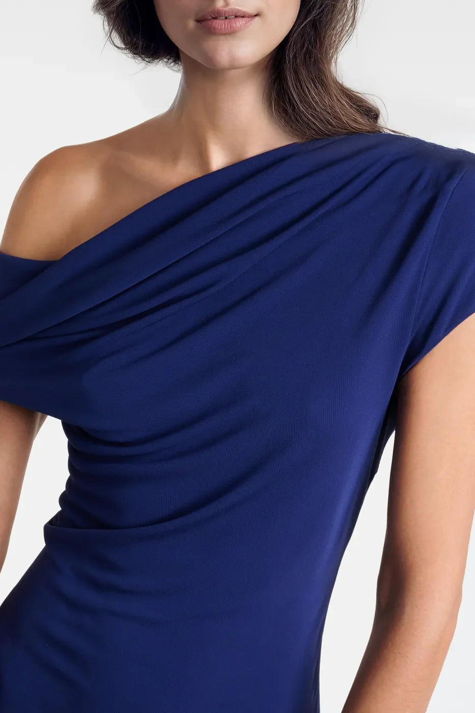 Sophisticated one-shoulder dresses made from soft jersey, showcasing elegance and style.