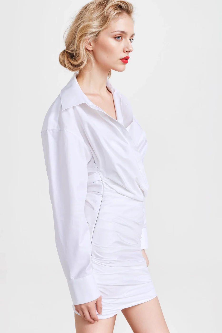 "Chic white dresses with asymmetric details and a modern silhouette."