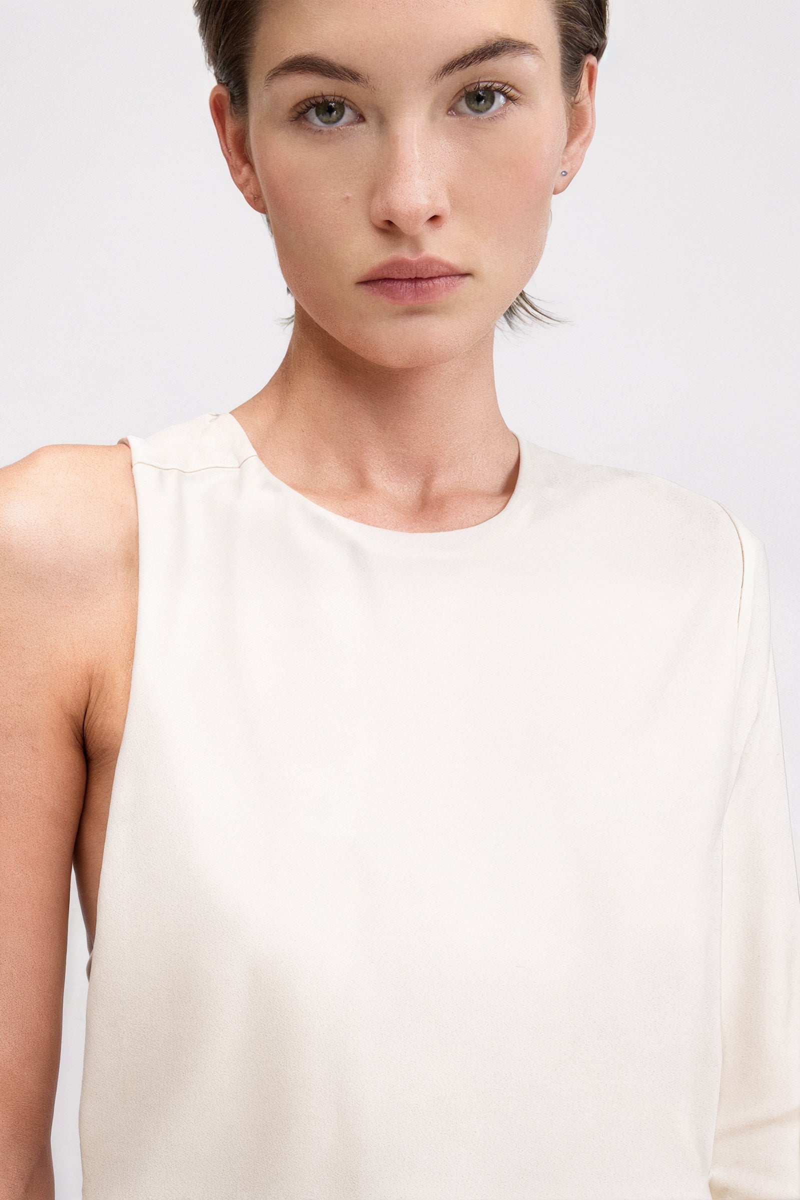 Designer asymmetric dress with crew neck and open back