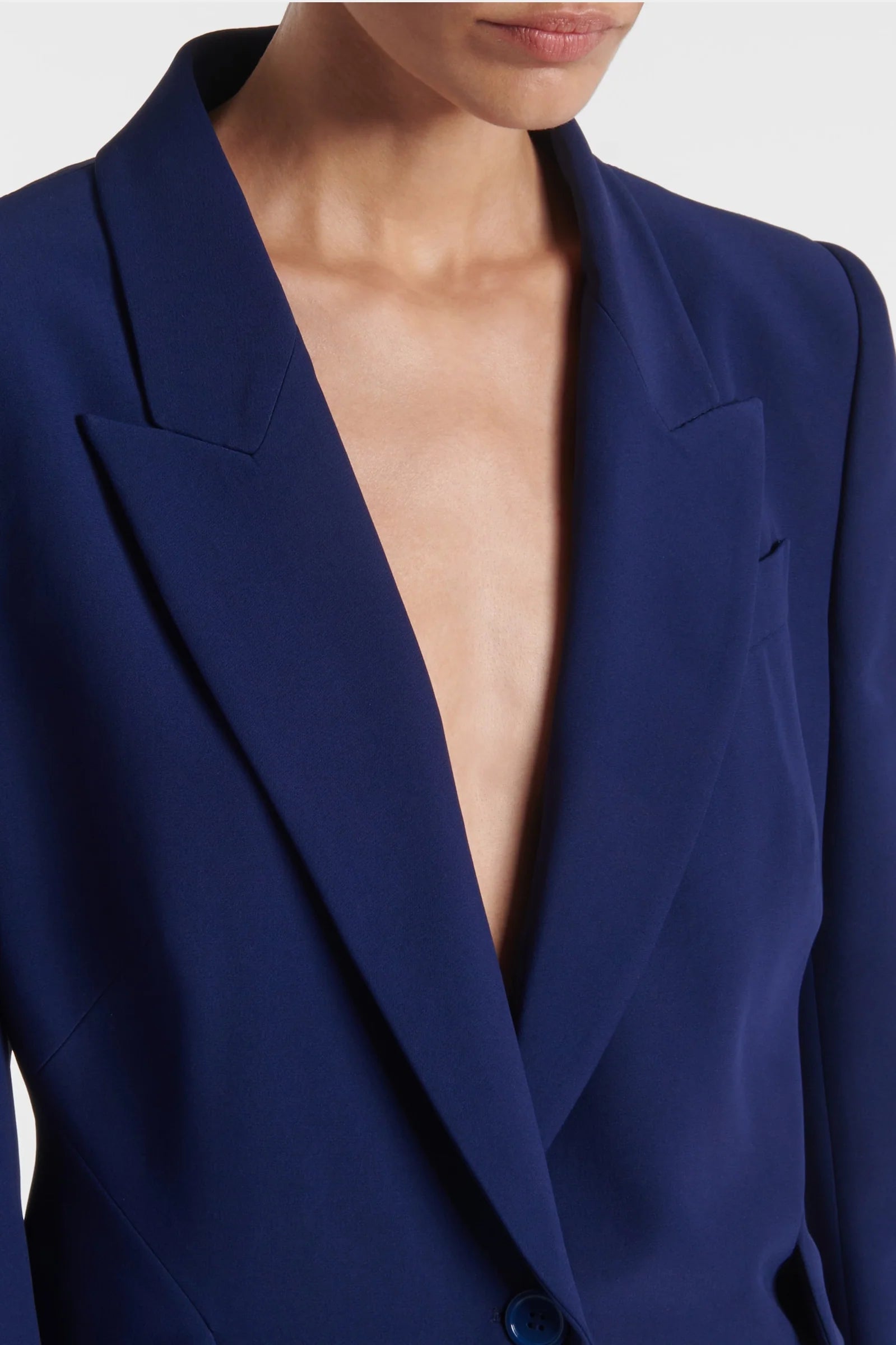 Blue blazer with notched lapels – close-up detail