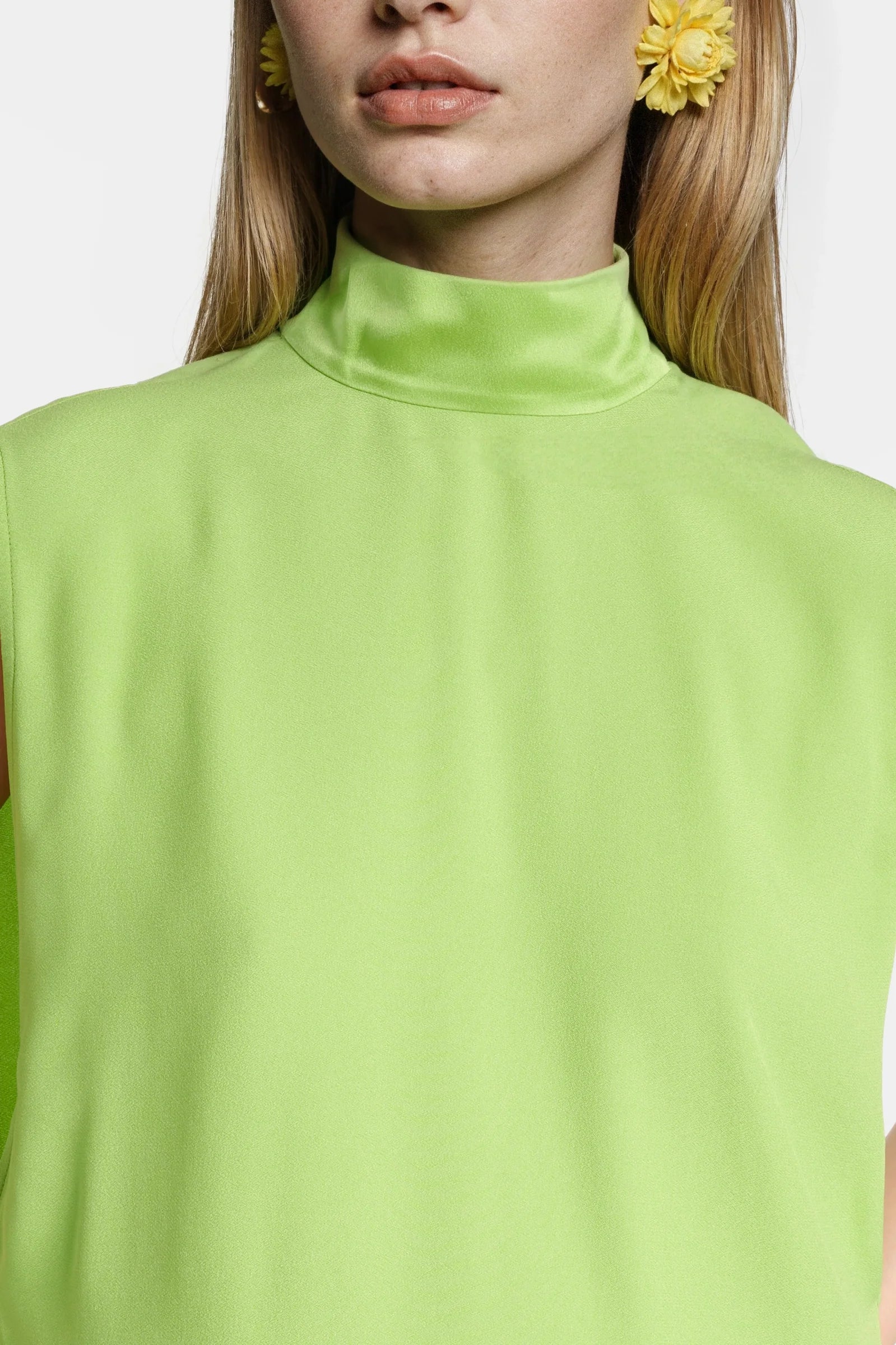 Green crepe dress with back slit and flowing hemline