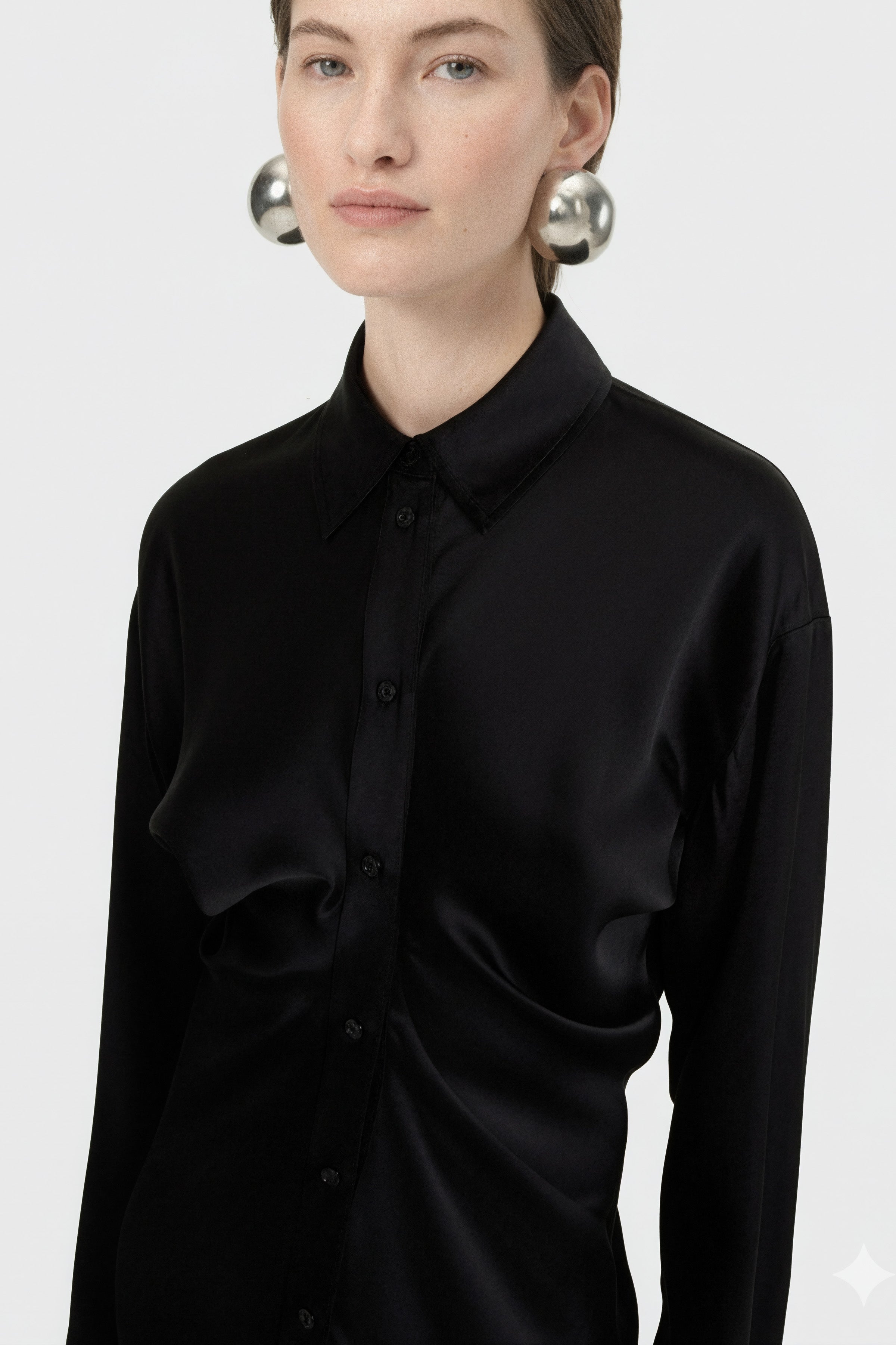 Close-up shot of the Felipe Albernaz black satin shirt dress highlighting the pointed collar, front button-down closure, and intricate ruching detail at the waist.