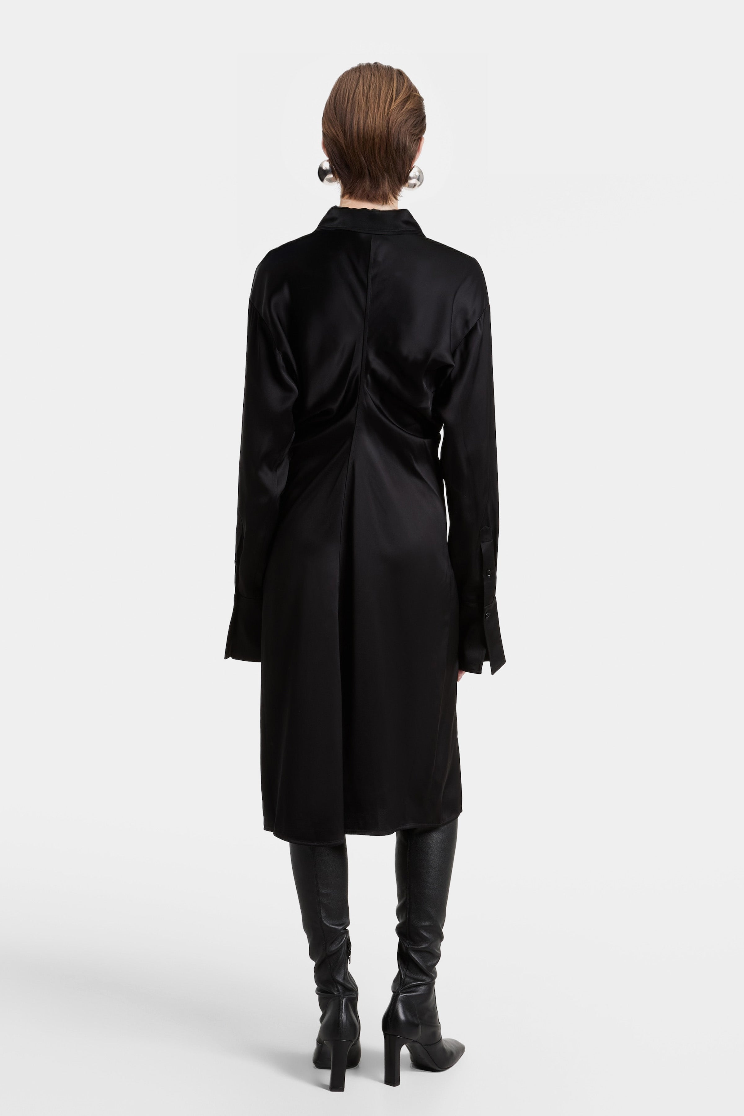 Rear view of the Felipe Albernaz black satin midi dress, showcasing the fluid drape of the fabric and the structured back-seam construction.