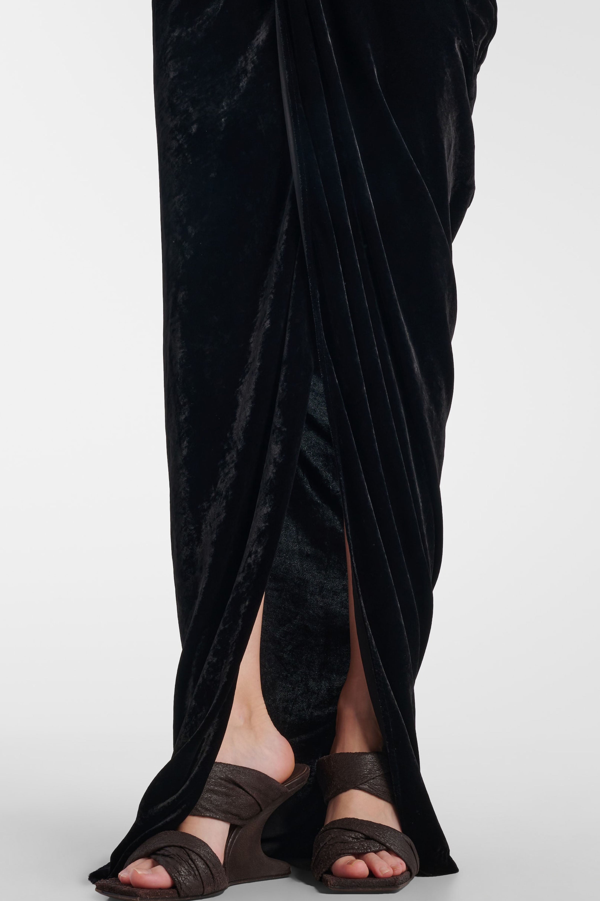 Close-up of front slit and luxurious velvet texture of Felipe Albernaz Velvet Wrap Black Dress