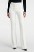 Model wearing ivory tailored flare pants, front view, with black pointed shoes.