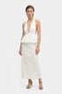 White halter peplum dress, front view, deep neckline, mid-length, model standing.