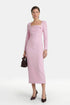 Model in pink midi dress, long sleeves, square neckline, holding a brown handbag.