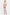 Model wearing asymmetric cutout maxi dress, holding silver bag, transparent heels. Front view.