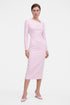 Model wearing soft pink asymmetrical dress, front view, long sleeves, knee-length.