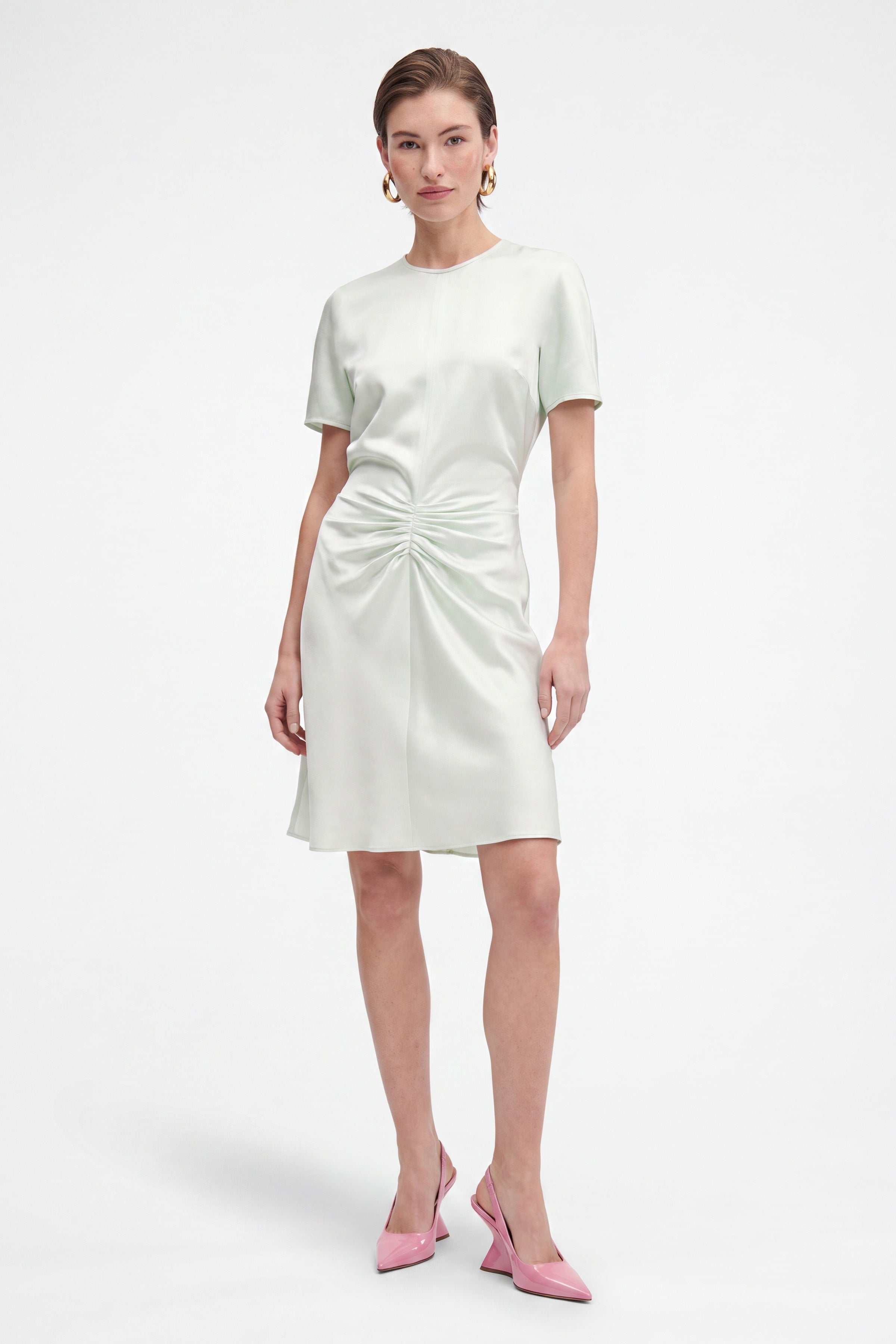 Mint ruched satin dress, short sleeves, front view, model wearing pink heels.