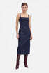 Front view Denim Square Neck Midi Dress with model wearing burgundy boots.