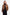 Cognac leather bomber jacket, front view, worn by model, black turtleneck dress.