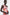 Watercolor one-shoulder dress with knot detail, worn by model, front view.