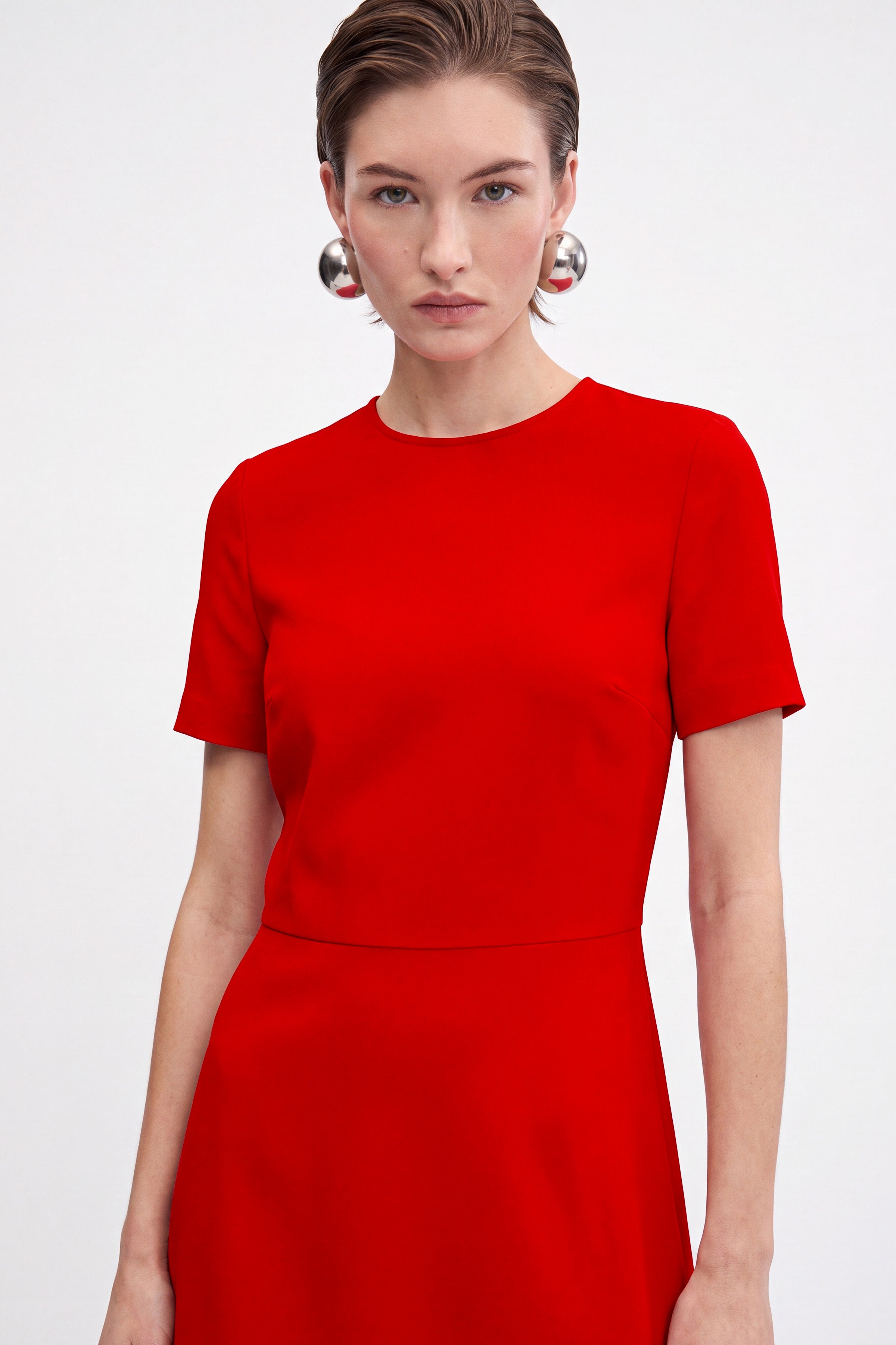 Front view of Scarlet Flounce Hem Dress with short sleeves on model.
