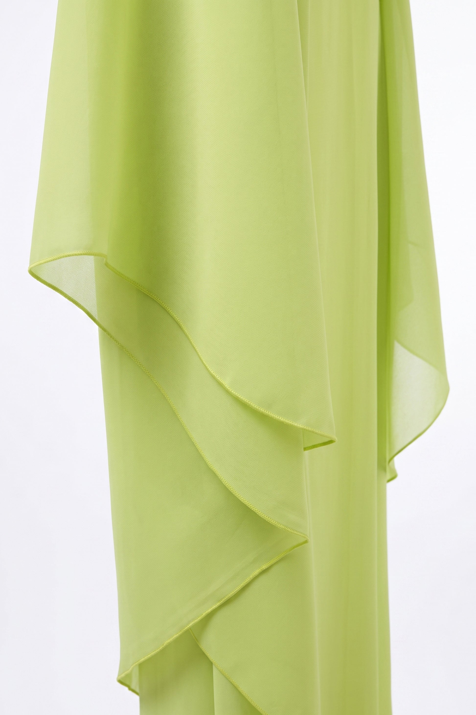 Detail of the chiffon cape lime green dress