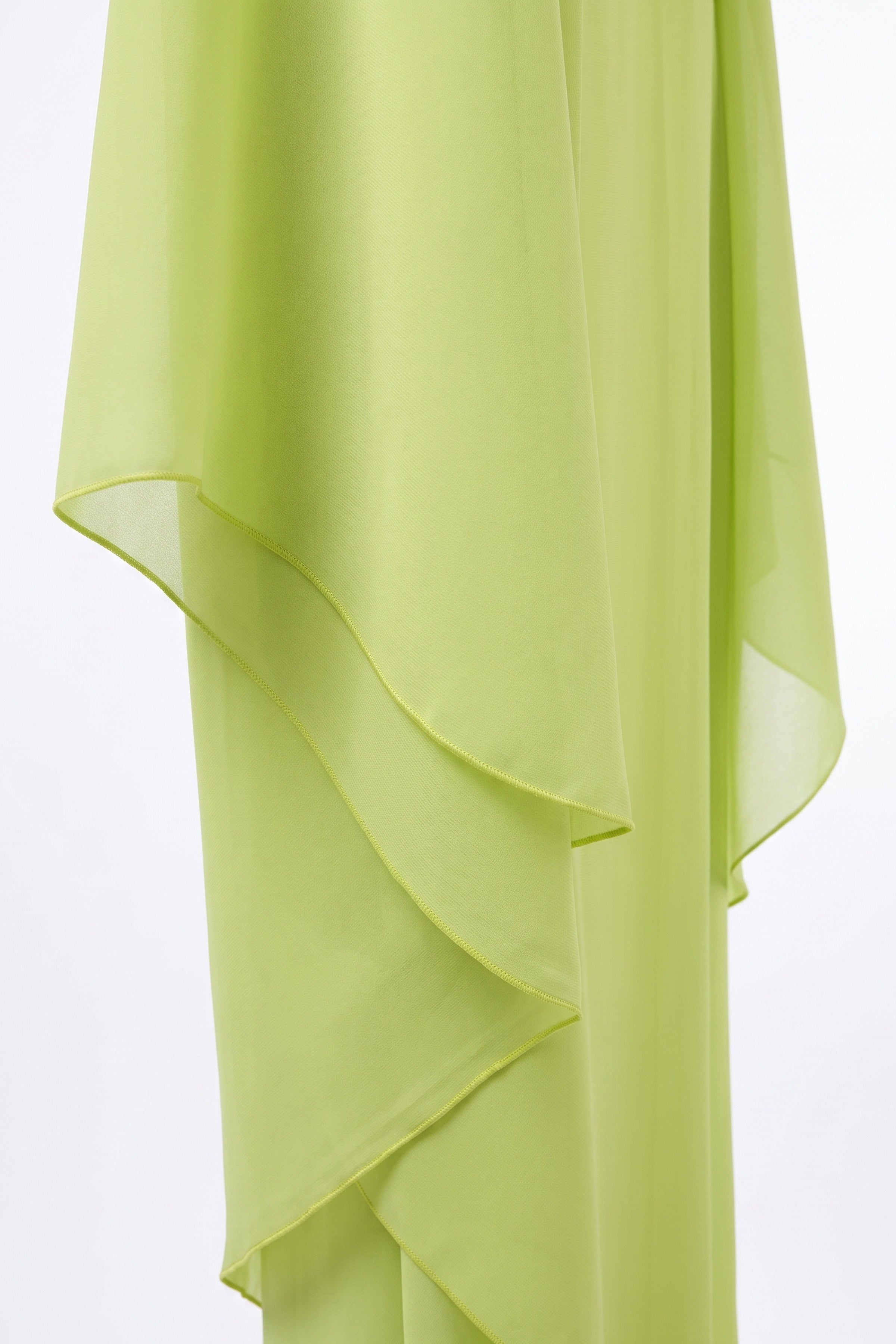 Detail of the chiffon cape lime green dress