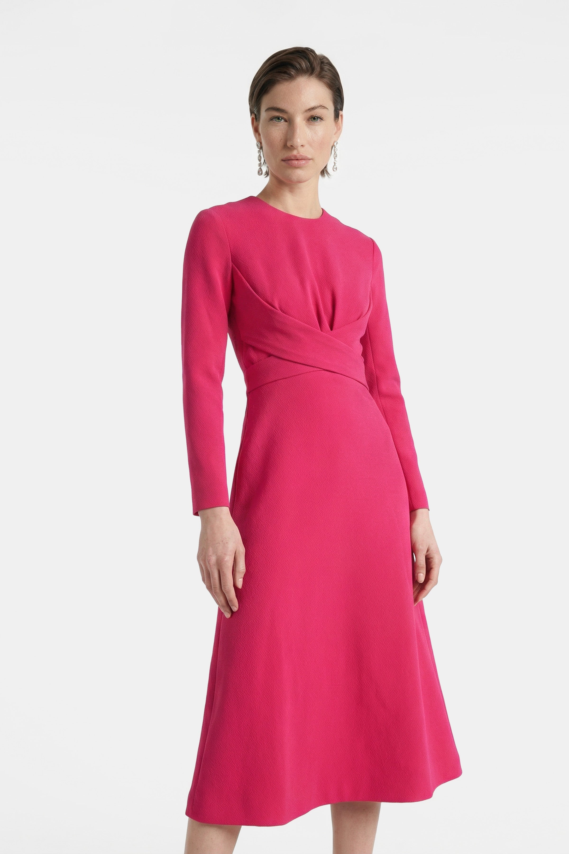Front view of elegant fuchsia midi dress with long sleeves and gathered waist detail.