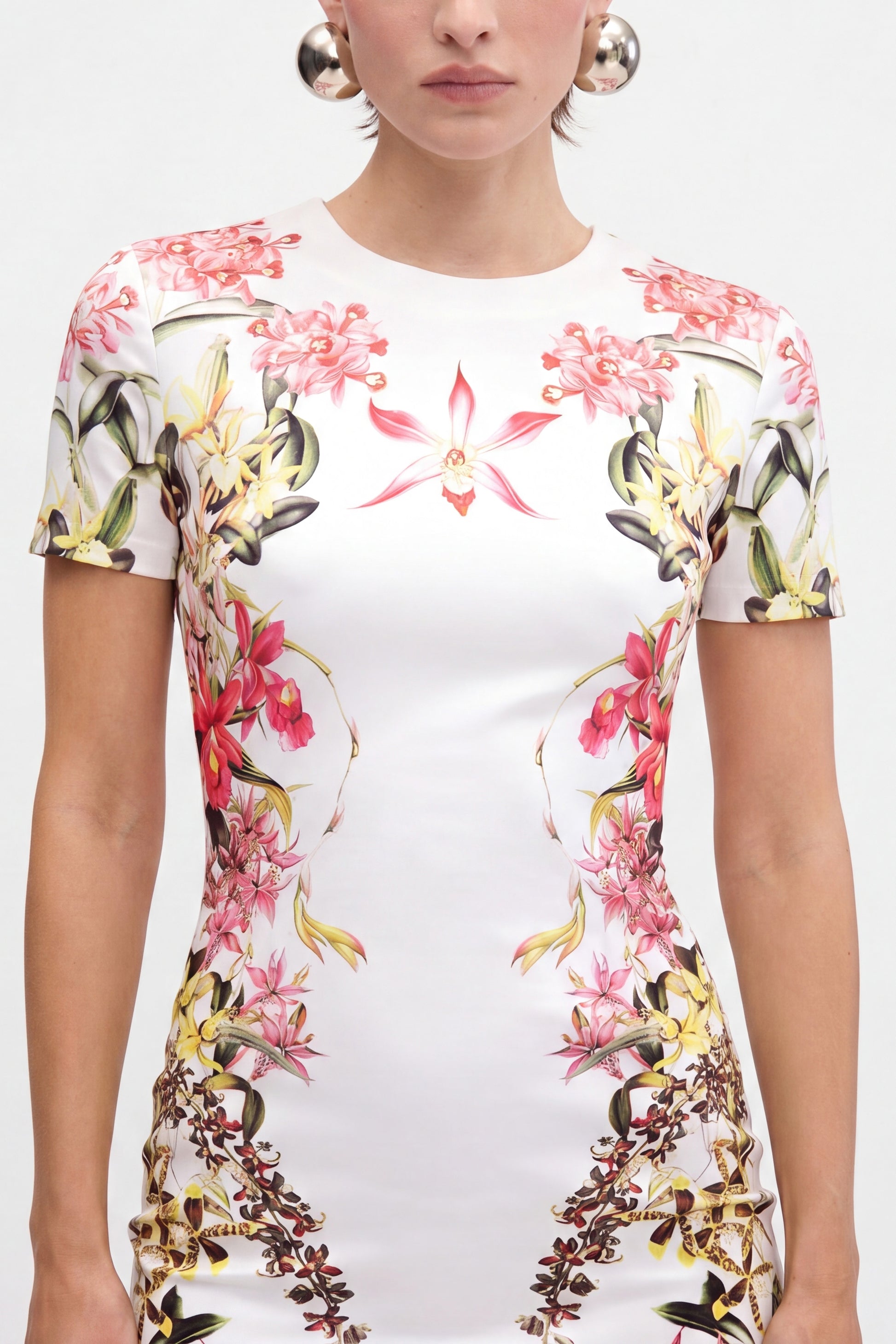 Front view of floral print jersey mini dress, short sleeves, intricate pattern.