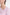 Close-up of soft pink asymmetrical dress neckline with delicate pleat detail.