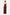 Back view of model wearing burgundy strapless slit gown, standing gracefully.