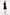 Model wearing black ruffle hem dress, back view, pink heels, sleek hairstyle.