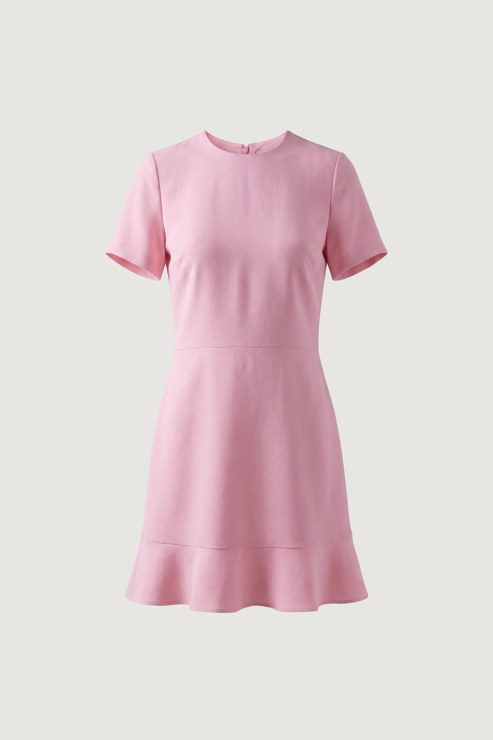 Front view of pink flounce hem dress with short sleeves and simple neckline.