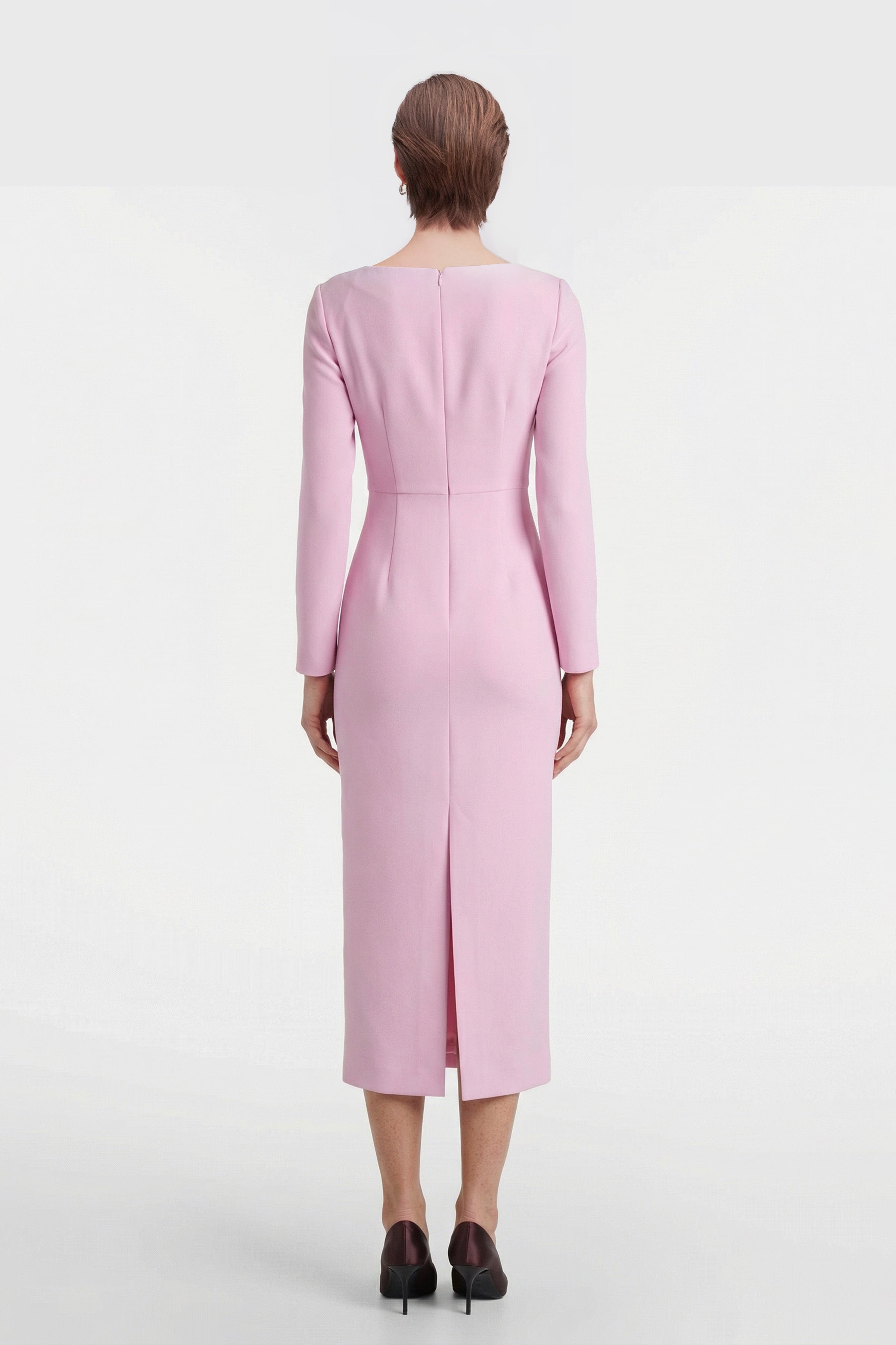 Back view of Blush Elegance Midi Dress with long sleeves and rear slit.
