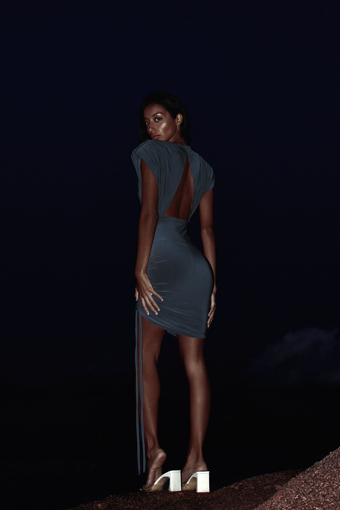 Dark grey cocktail dresses with backless design and chic shoulder pads.