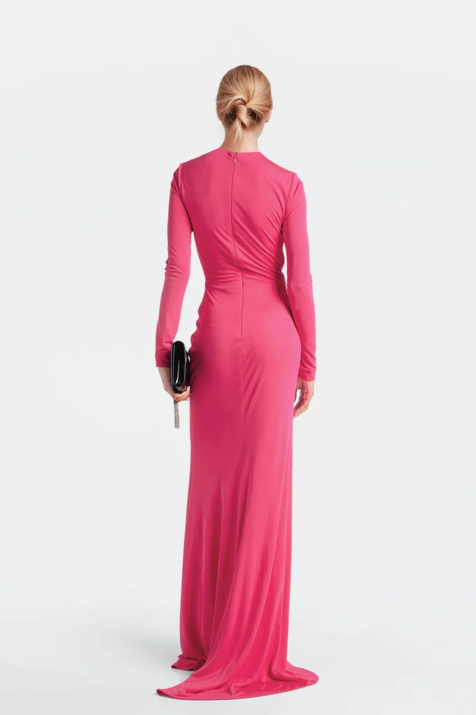 Graceful long dresses designed in Madrid with enveloping draping for a perfect fit.