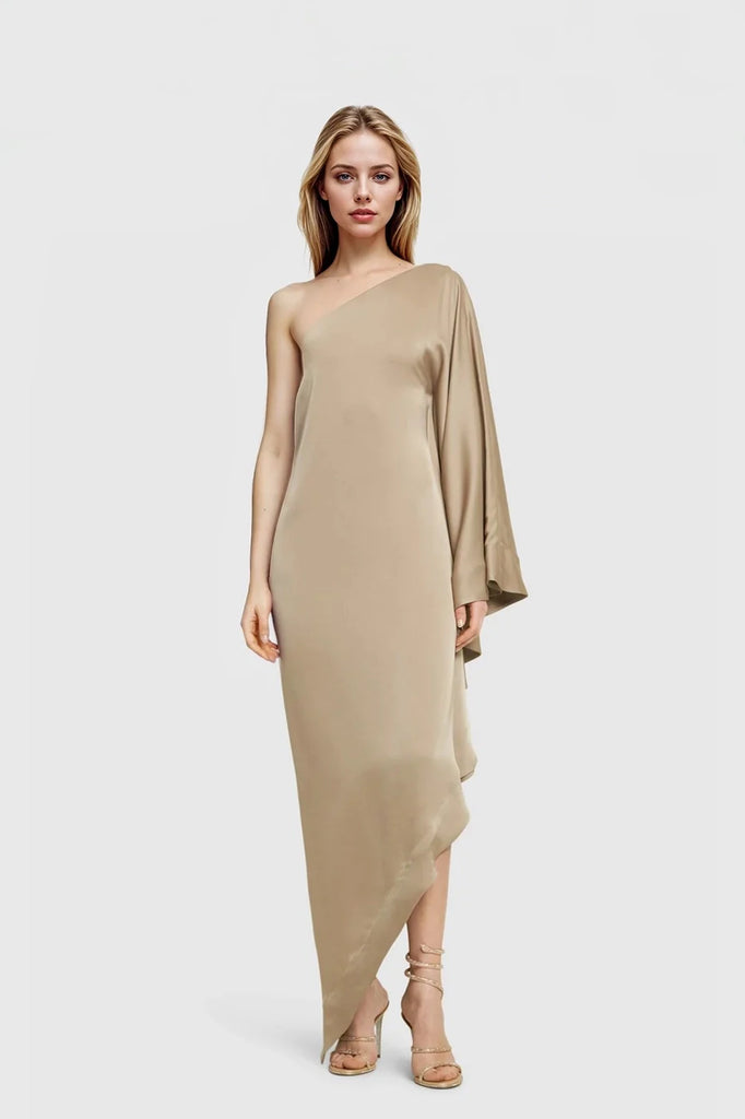 Alexa Strapless Asymmetric Maxi Dress in beige showcasing one-sleeve design.