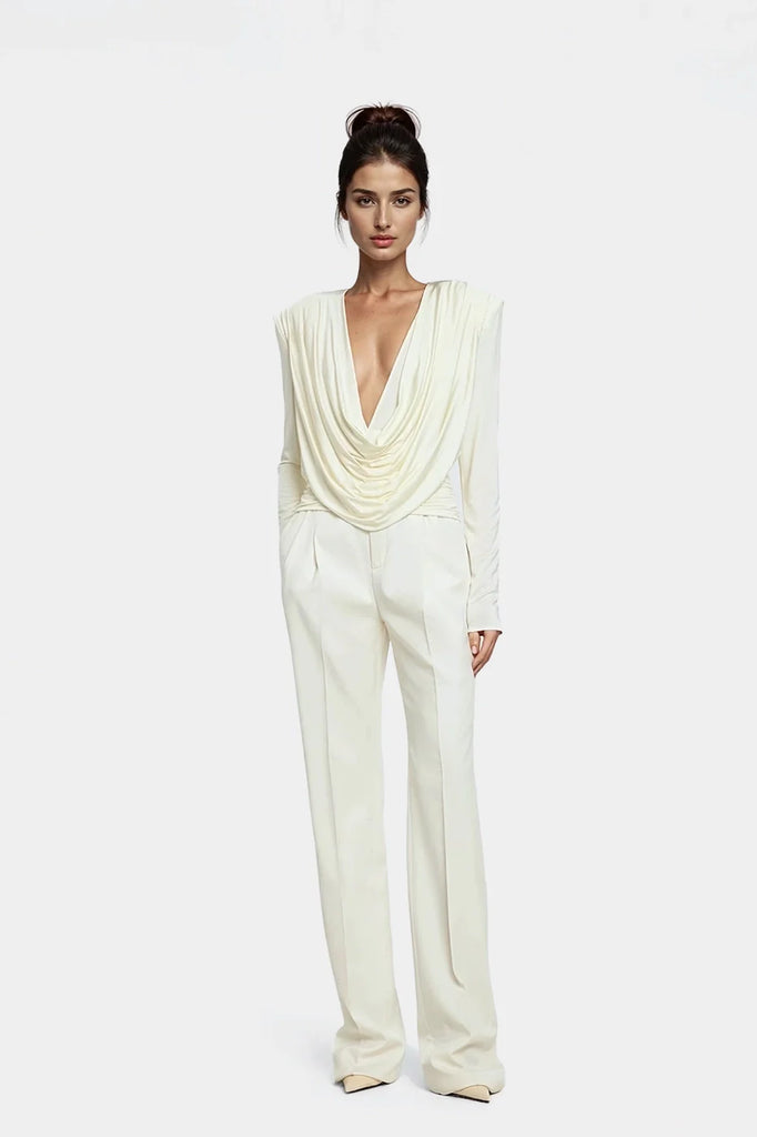 Elegant off-white draped top with cascading pleats.