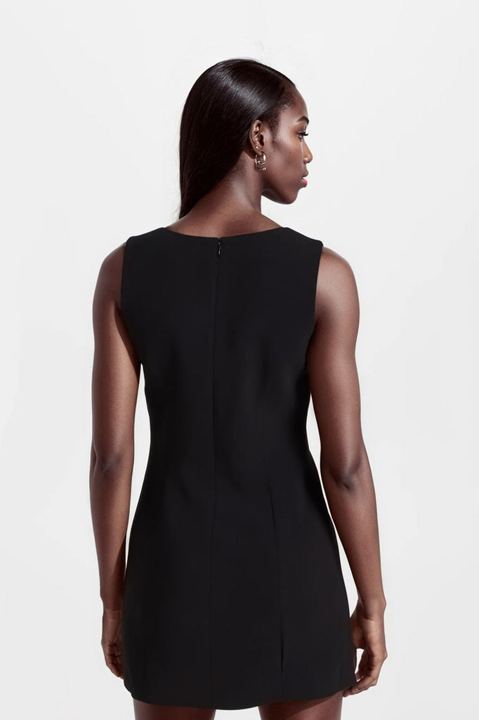 Sleek black mini dresses with asymmetric neckline, made in Madrid