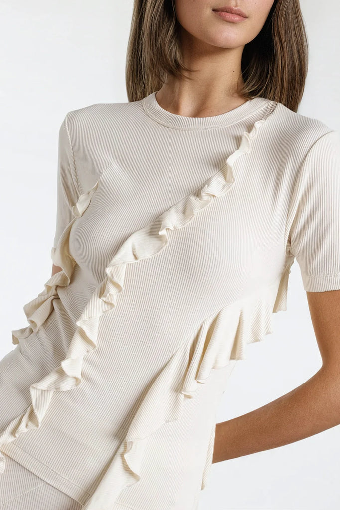 Off-white short-sleeve top featuring unique fringe for a trendy look.