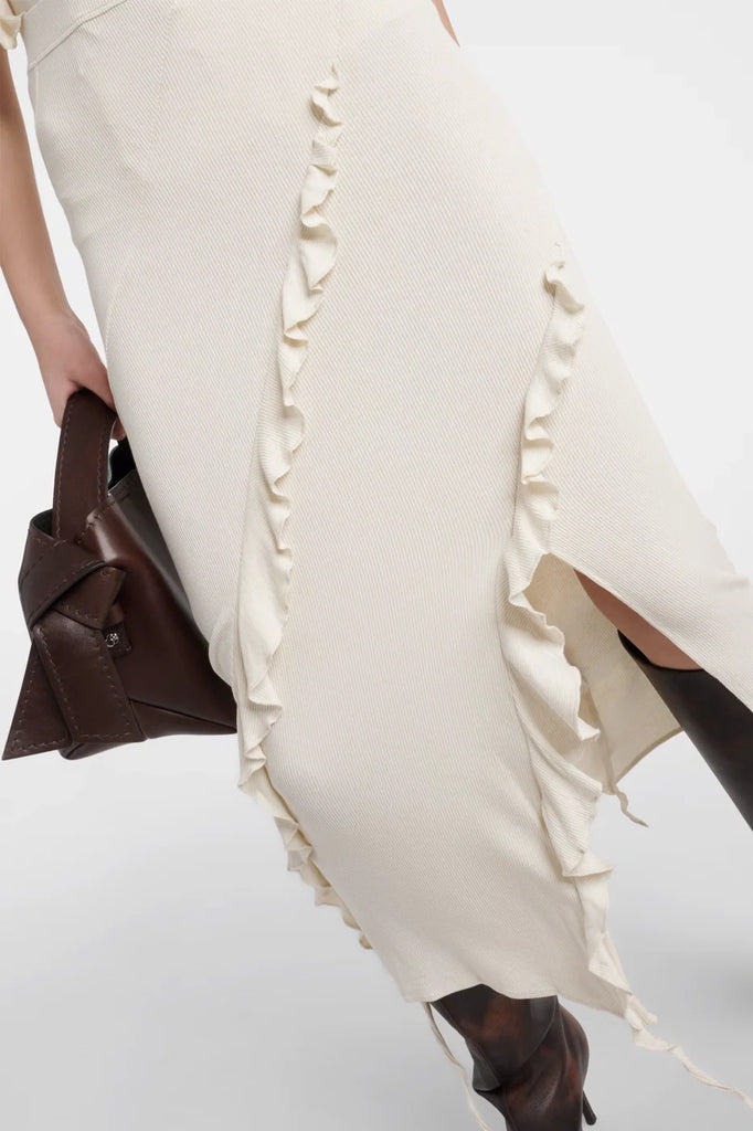 Sadie Fringed Skirt in off-white with asymmetrical fringe detailing.