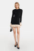 Luna Ruched Mini Dress in black with cream cuff trim and elegant ruching.
