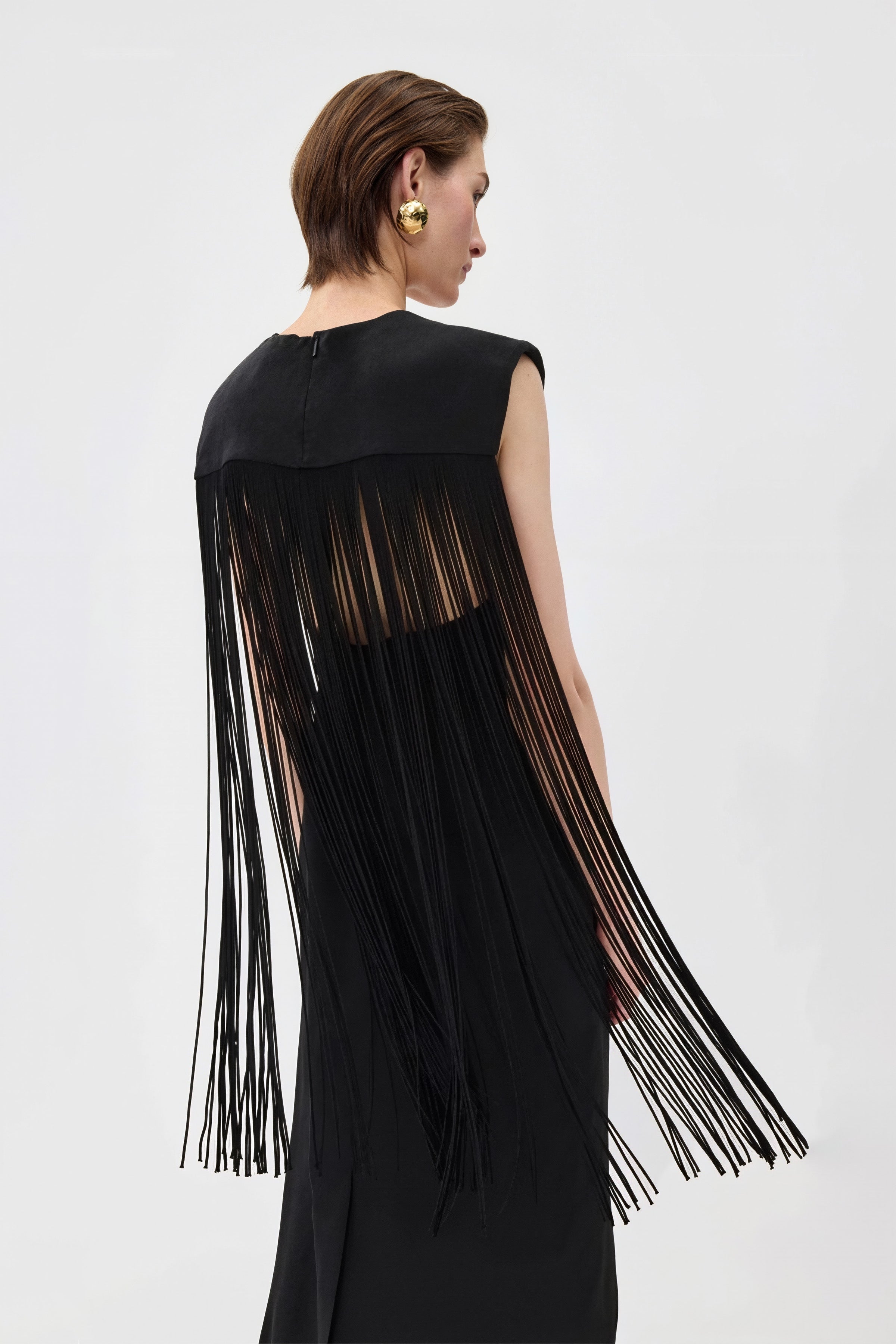 Clara Fringed Dress in black with a chic fringe overlay and adjustable shoulder straps.