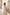 Elegant long beige trench coat with tie waist and minimalist design