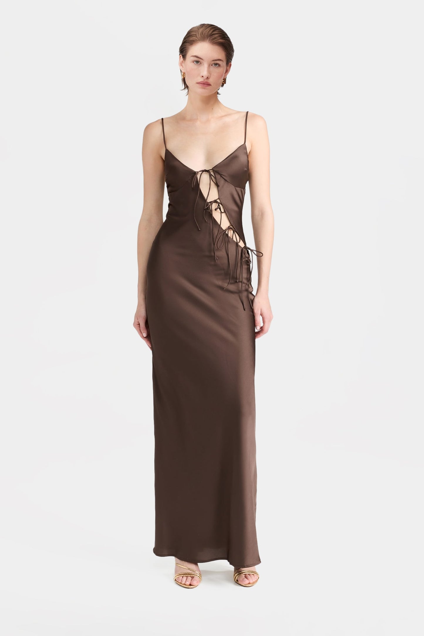 Brown satin maxi dress with front cut-outs and tie details.