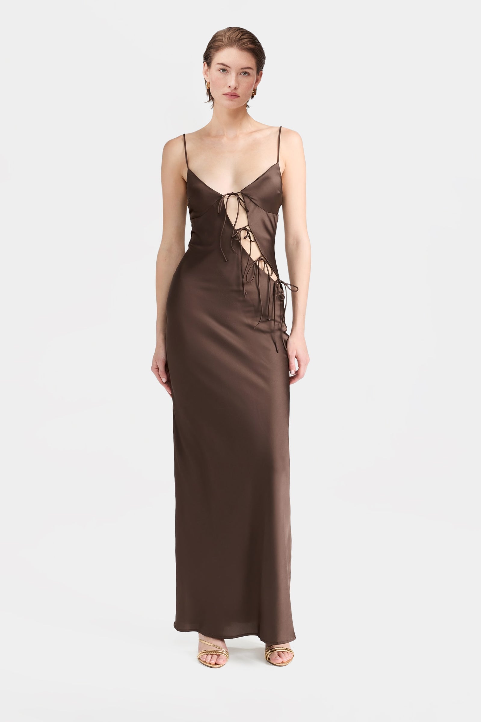 Brown satin maxi dress with front cut-outs and tie details.