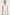 Close up profile of elegant cream jumpsuit showing fluid crepe fabric