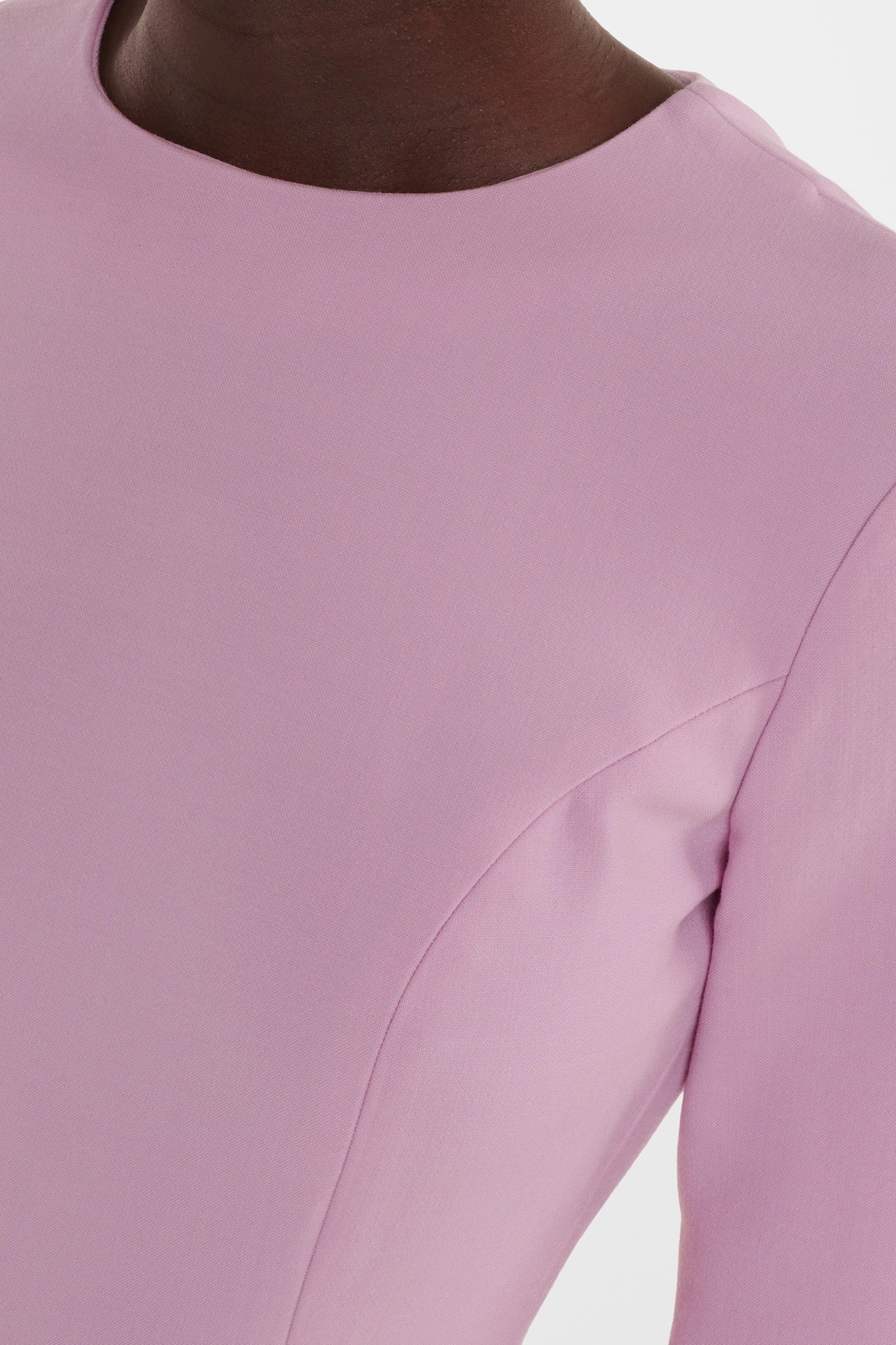 Pink ruffle midi dress, close-up of ruffle hem detail