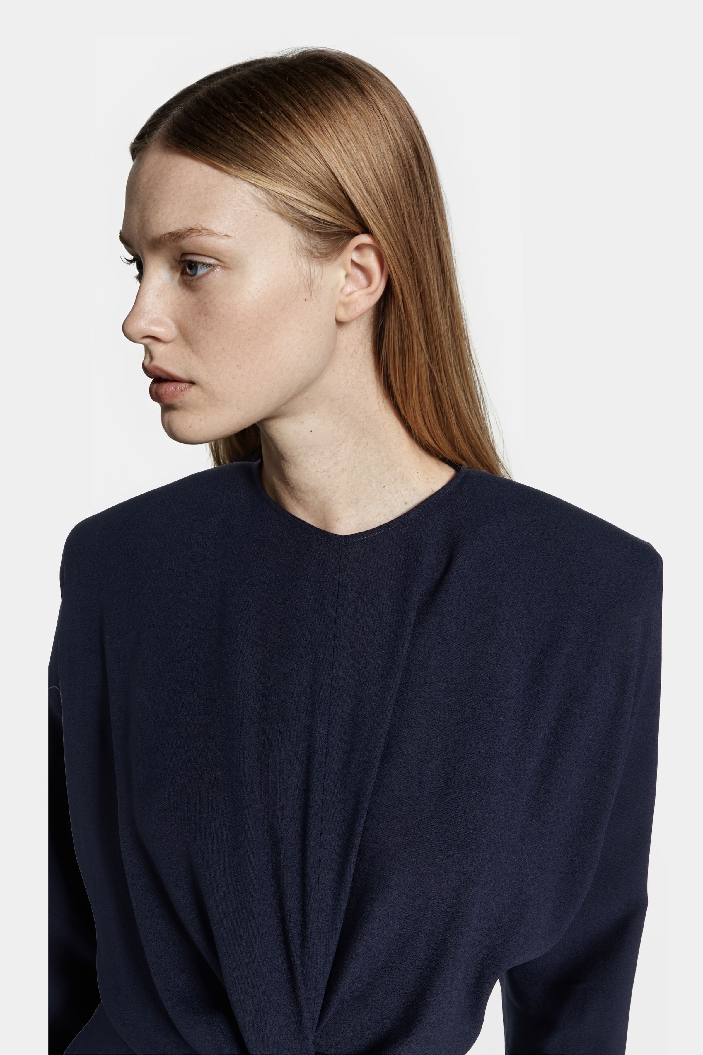 Close-up of front twist detailing on Felipe Albernaz Nok Navy Dress – refined draping and soft crepe texture