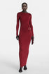 Model wearing red long sleeve ring dress by Felipe Albernaz