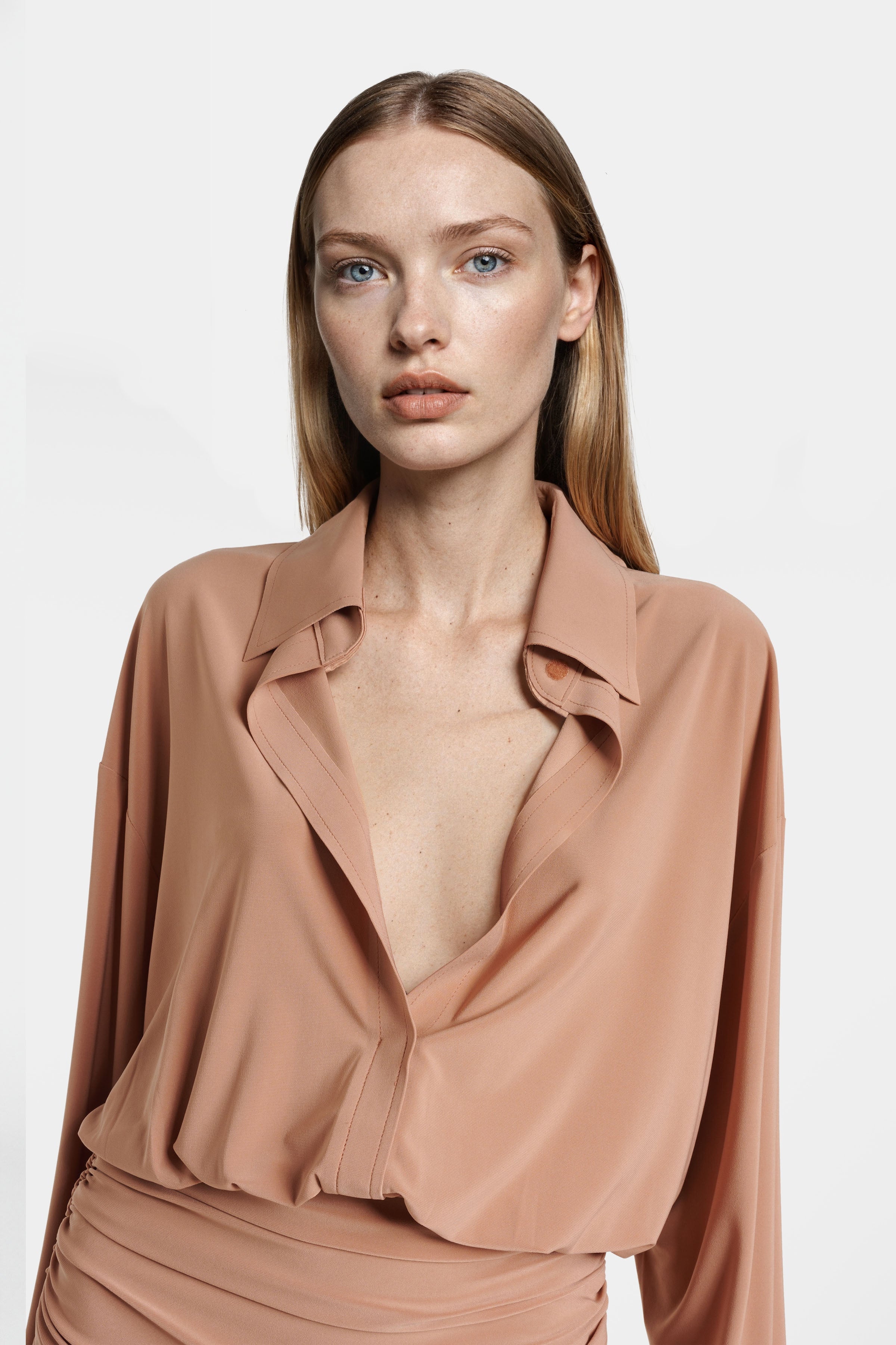 Close-up of collar and ruched draping on Felipe Albernaz brown shirred jersey dress – soft stretch fabric texture