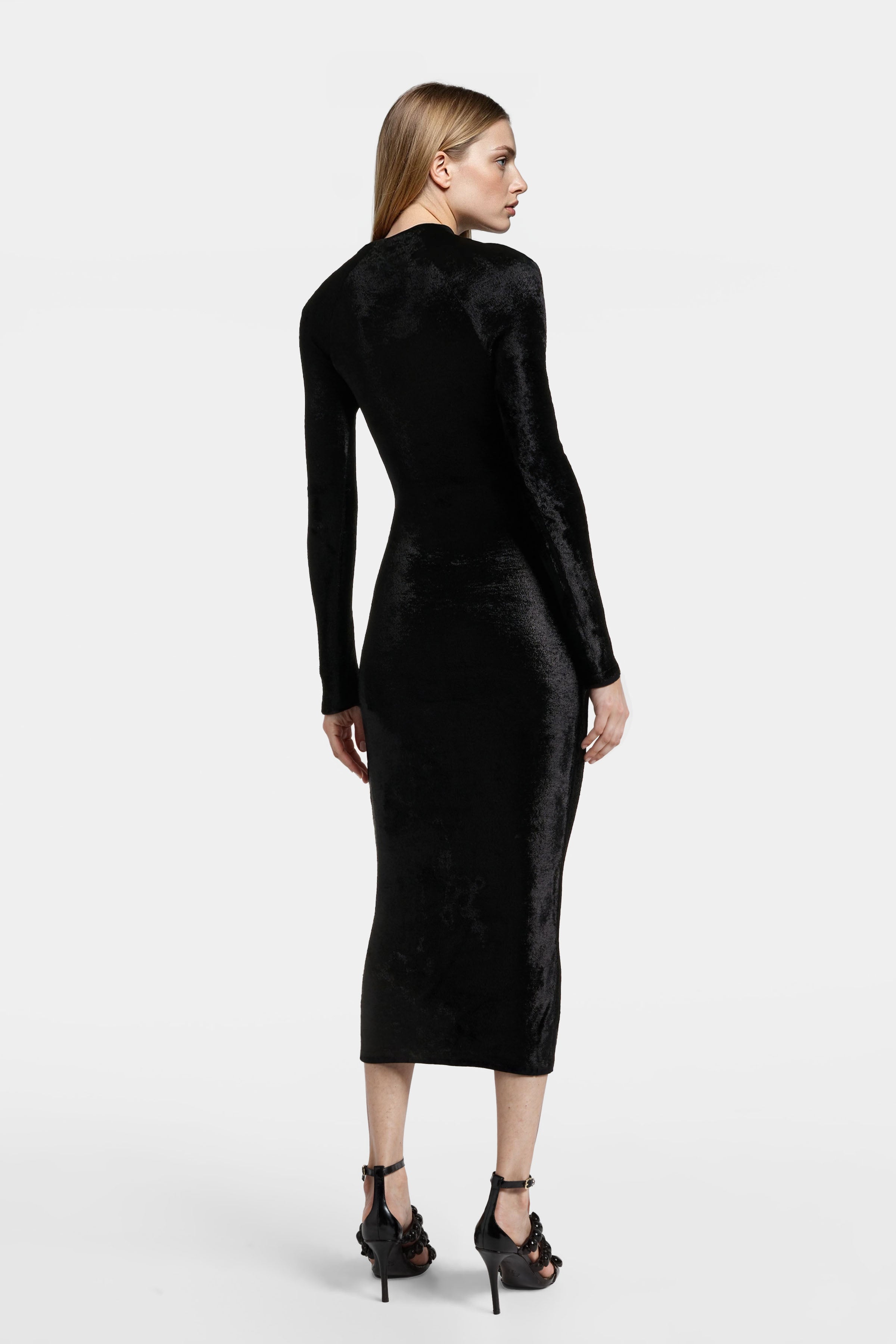 Model wearing Felipe Albernaz black velvet midi dress – back view showing sculpted fit